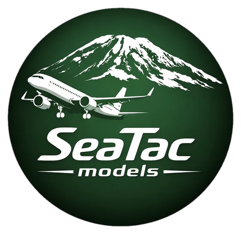 SeaTac Models logo — airplane and Mount Rainier in a green circle